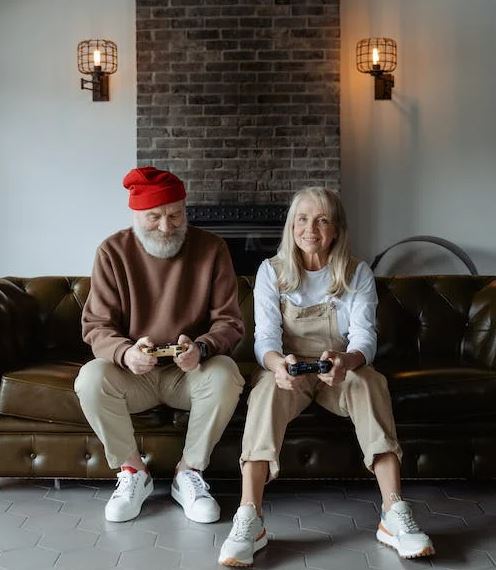elderly couple showing their shoes of choice