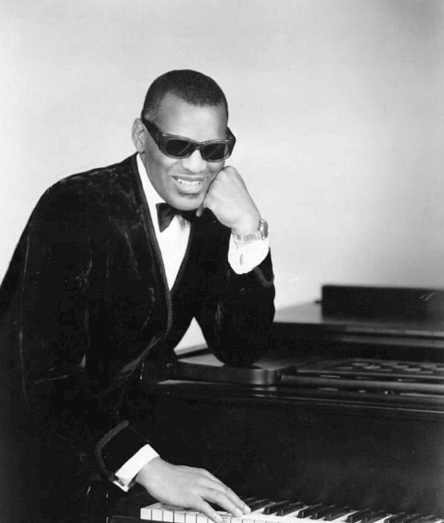 ray charles in one of his classic poses at the piano