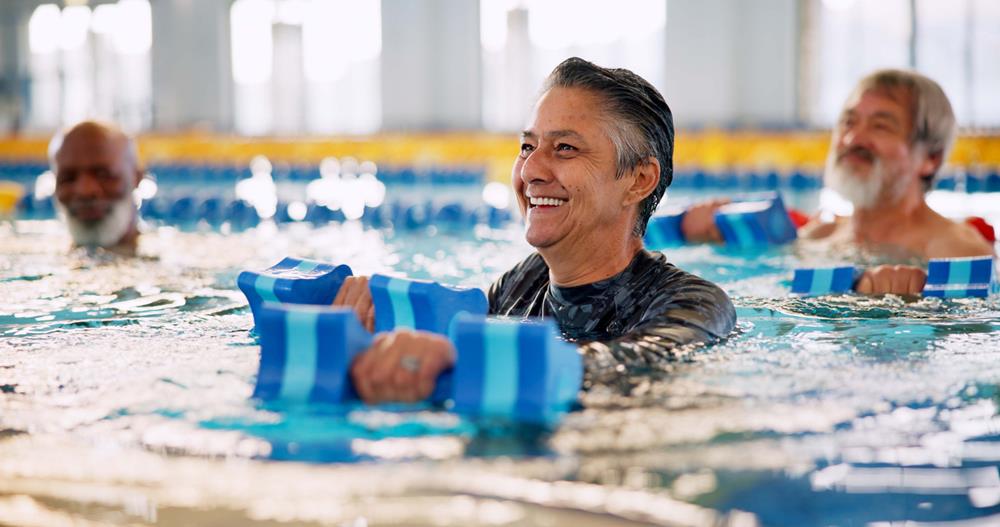 A group of seniors in swimming pool for exercise